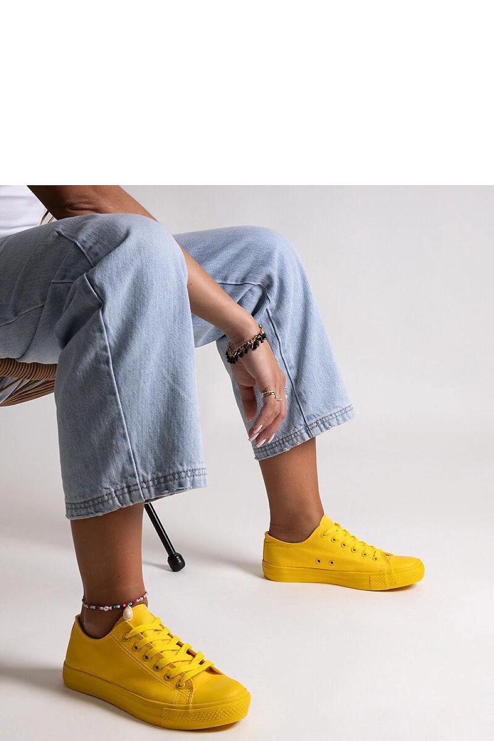 Close-up of Solea Yellow Classic Nudar Sneakers demonstrating the innovative rubber sole for excellent grip and chic summer elegance.