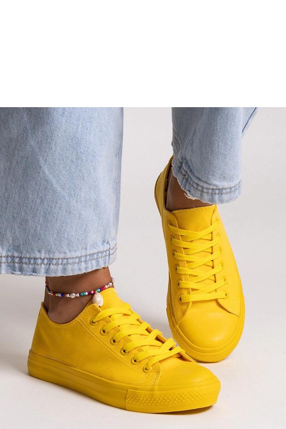 Solea Yellow Classic Nudar Sneakers presented in an outdoor setting, ideal for summer adventures with adjustable lace-up detail.