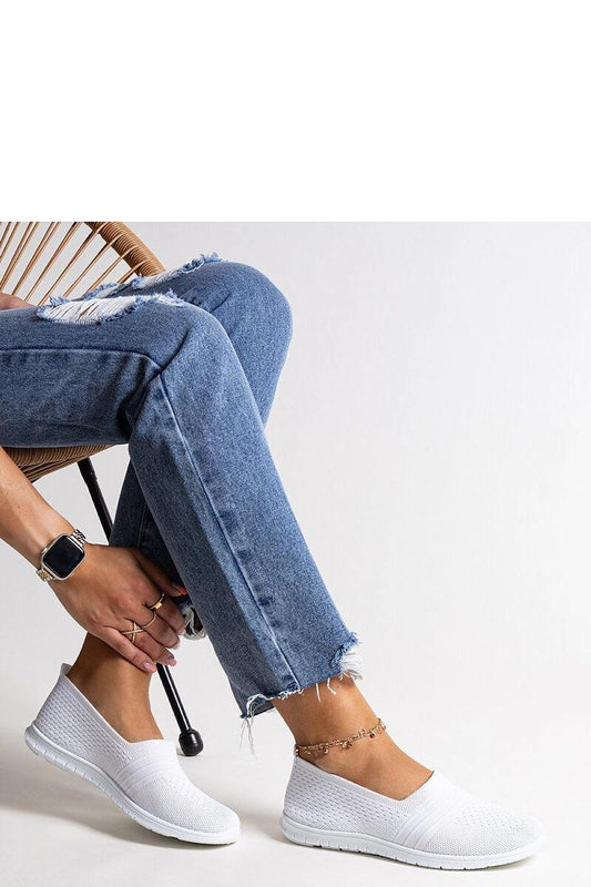 Solea white slip-on sneakers for women, showcasing a minimalist design with a rounded toe, perfect for summer casual elegance.