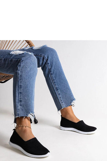 Elegant Solea black slip-on sneakers for women, showcasing comfortable fabric and rubber design, perfect for casual summer outings.