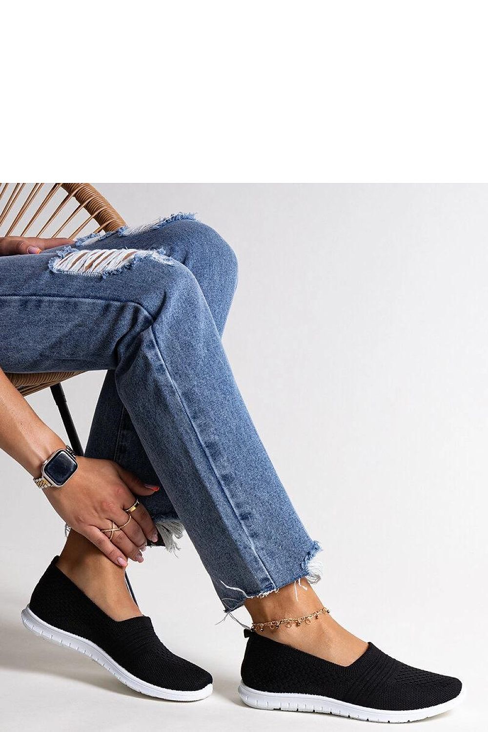 Close-up of Solea black slip-on sneakers, highlighting high-quality fabric upper and sleek round toe, ideal for versatile styling.