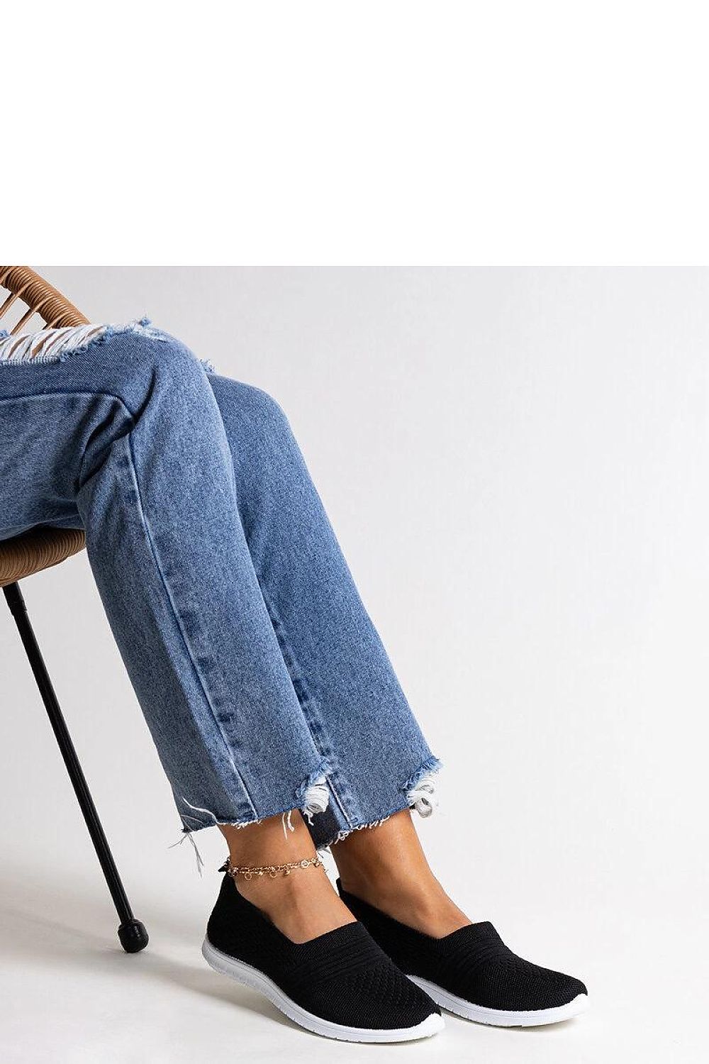 Solea black slip-on sneakers displayed on a soft surface, depicting the luxurious comfort and casual sophistication for everyday wear.