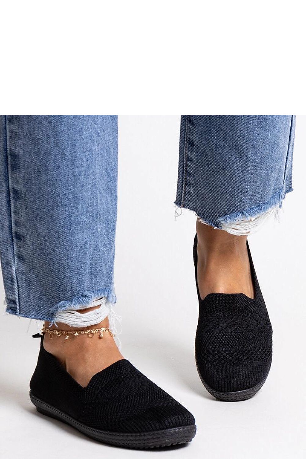 Sophisticated Solea women's black slip-on sneakers, designed with comfort and fashion in mind for luxurious summer outings.