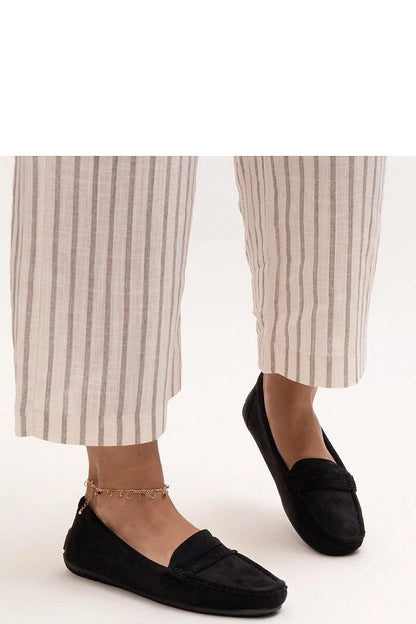 Close-up of Solea eco leather black Morton moccasins, featuring a rounded toe and slip-on style, embodying sophistication and timeless fashion.