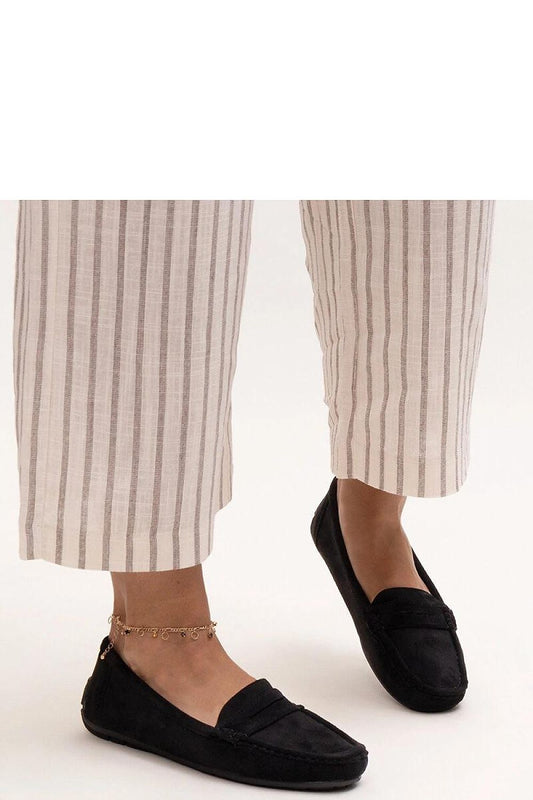 Close-up of Solea eco leather black Morton moccasins, featuring a rounded toe and slip-on style, embodying sophistication and timeless fashion.