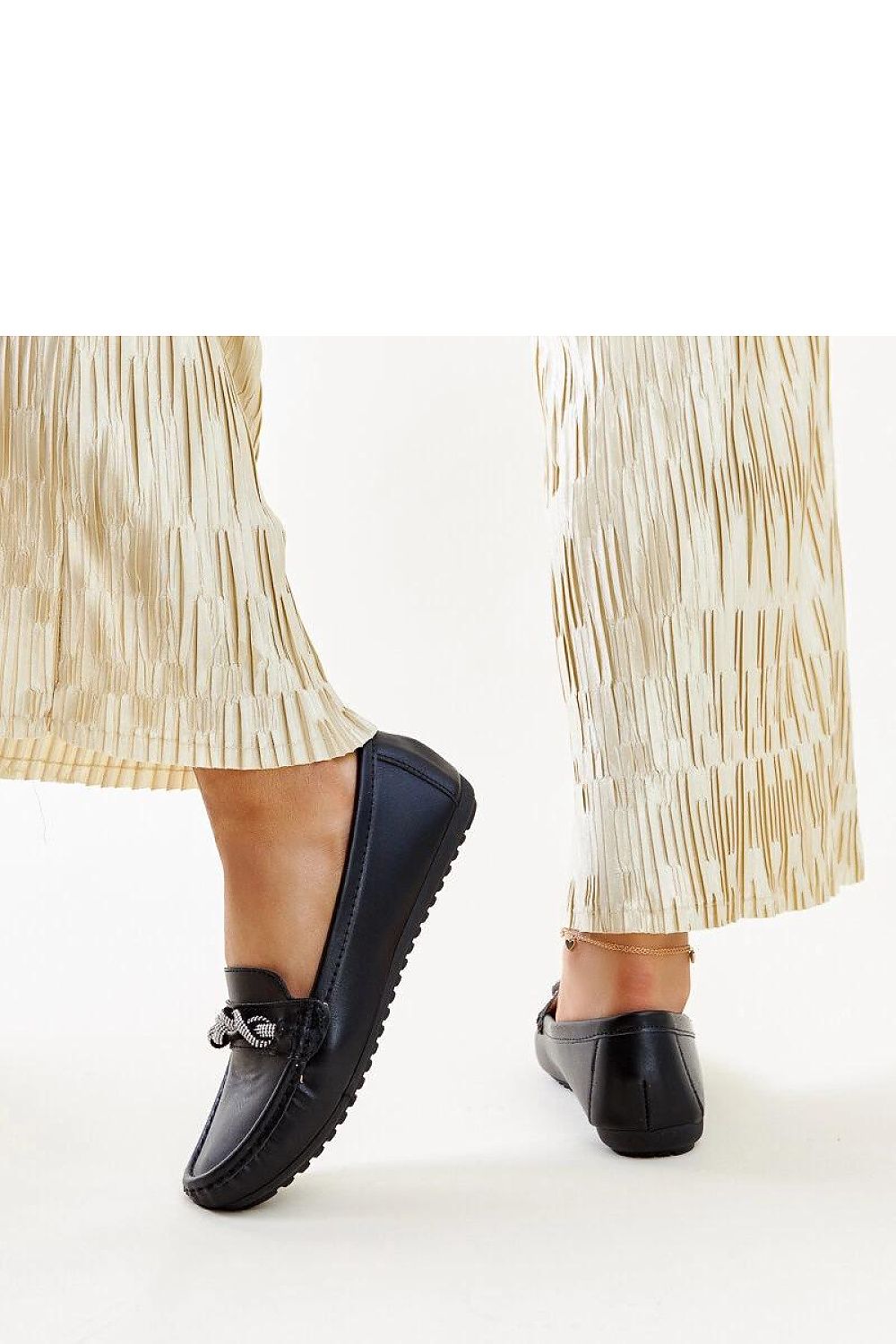 Luxury Solea black moccasins, complete with zircon embellishments, highlighting elegance in eco-friendly footwear.