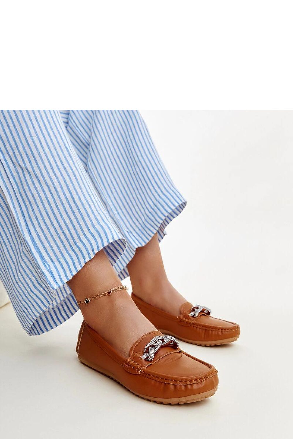 Solea black eco leather moccasins featuring sparkling zircon adornments, showcasing an elegant design.