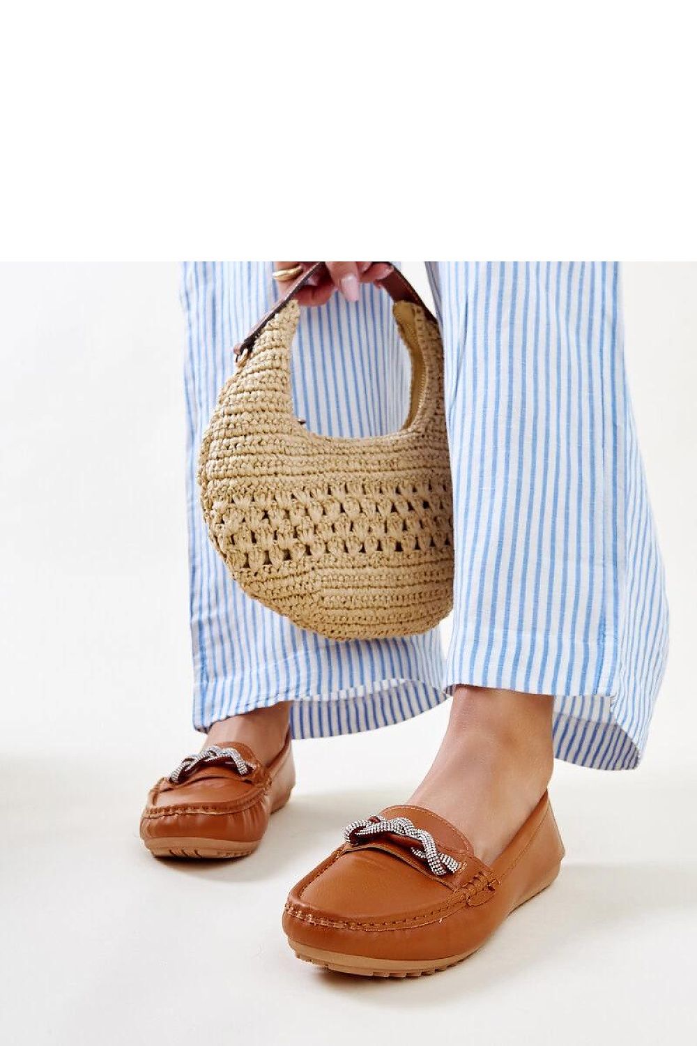 Close-up of Solea black moccasins highlighting high-quality eco leather and exquisite zircon details.