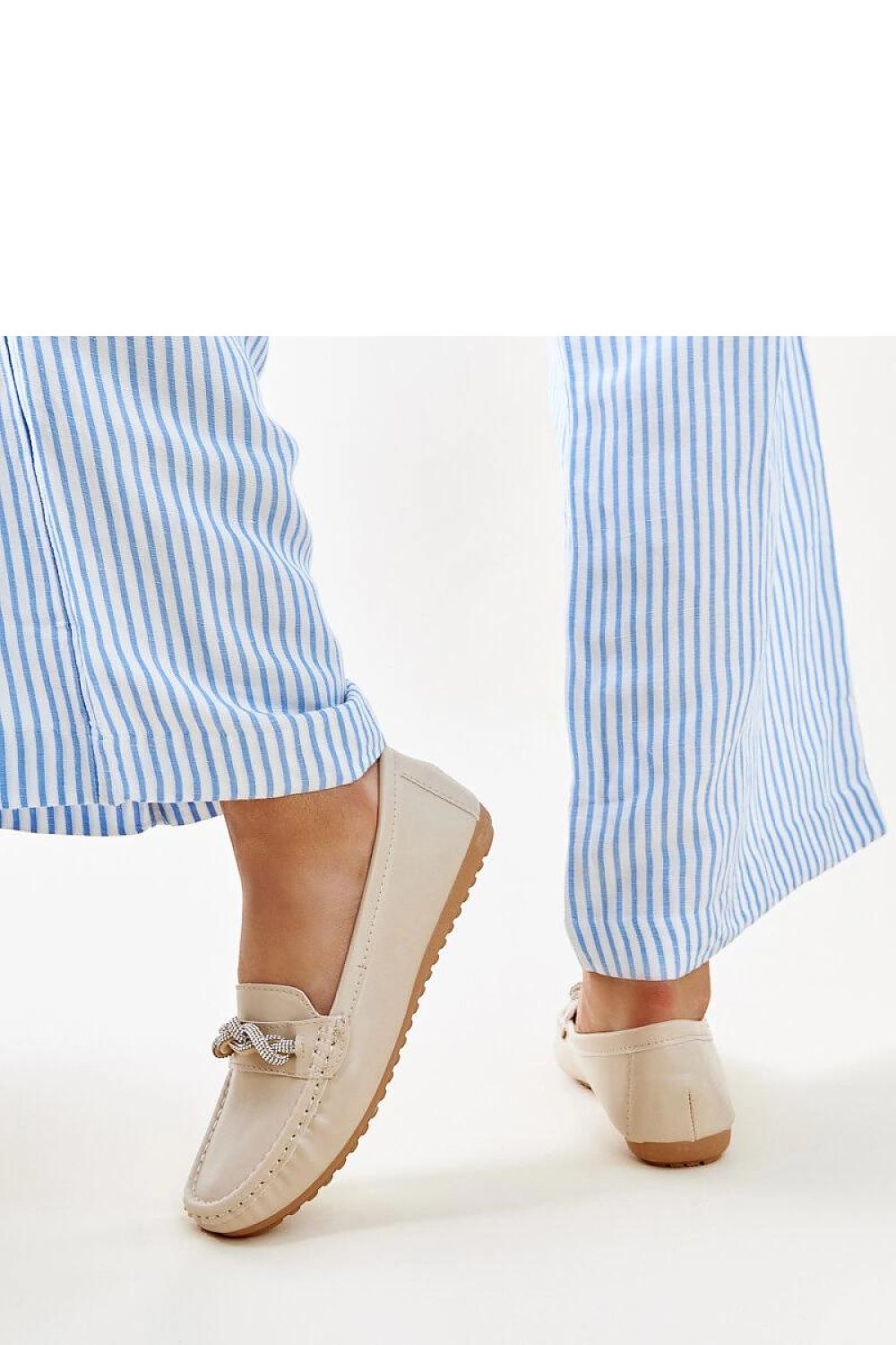 Close-up of Solea black moccasins highlighting exquisite zircon detailing, perfect blend of comfort and sophistication.