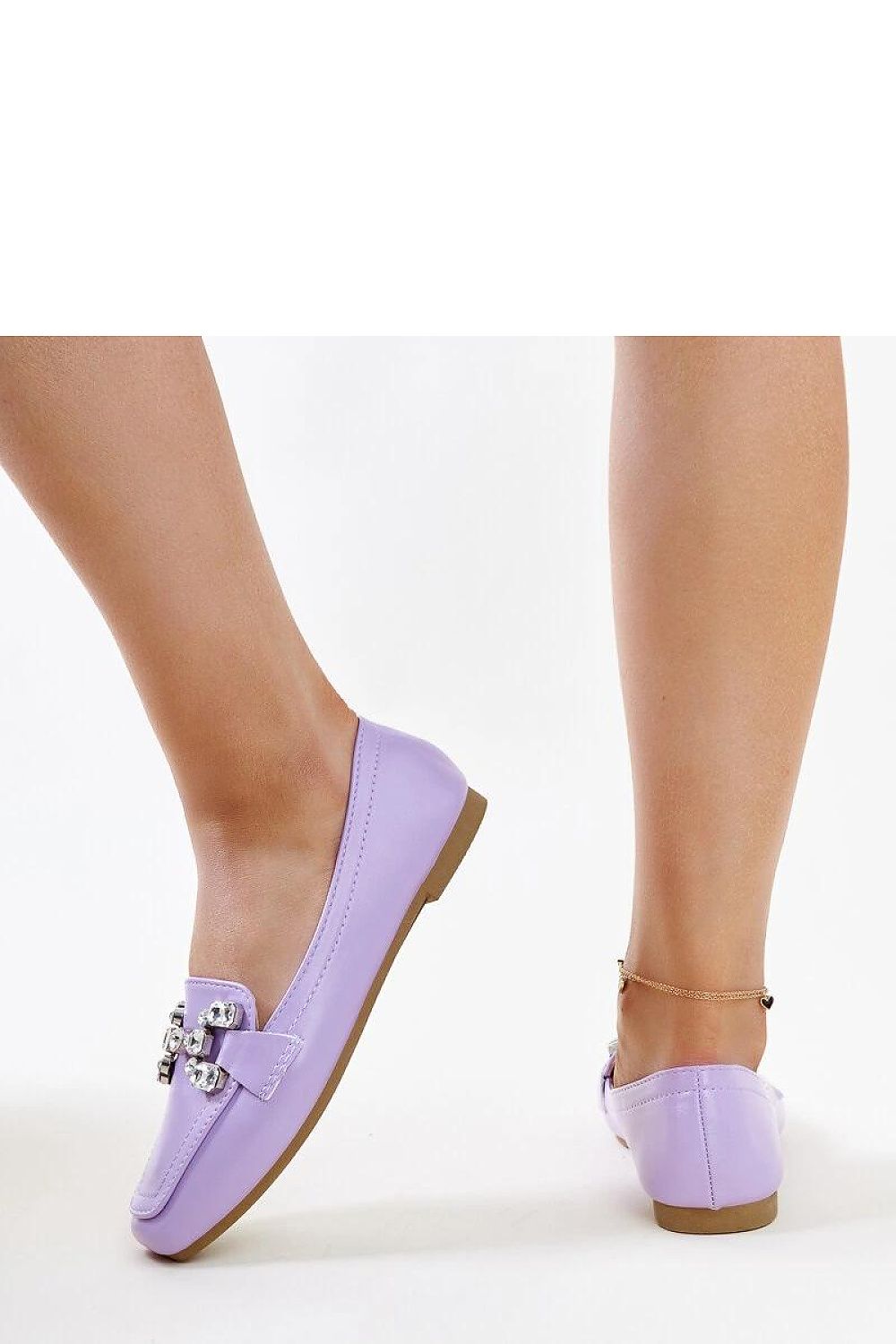 Close-up of Solea purple Mali moccasins with shimmering zircon buckle, highlighting sophistication and style.