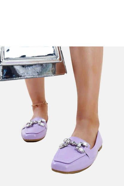 Solea purple Mali moccasins elegantly presented on a textured surface, exemplifying modern fashion and comfort.