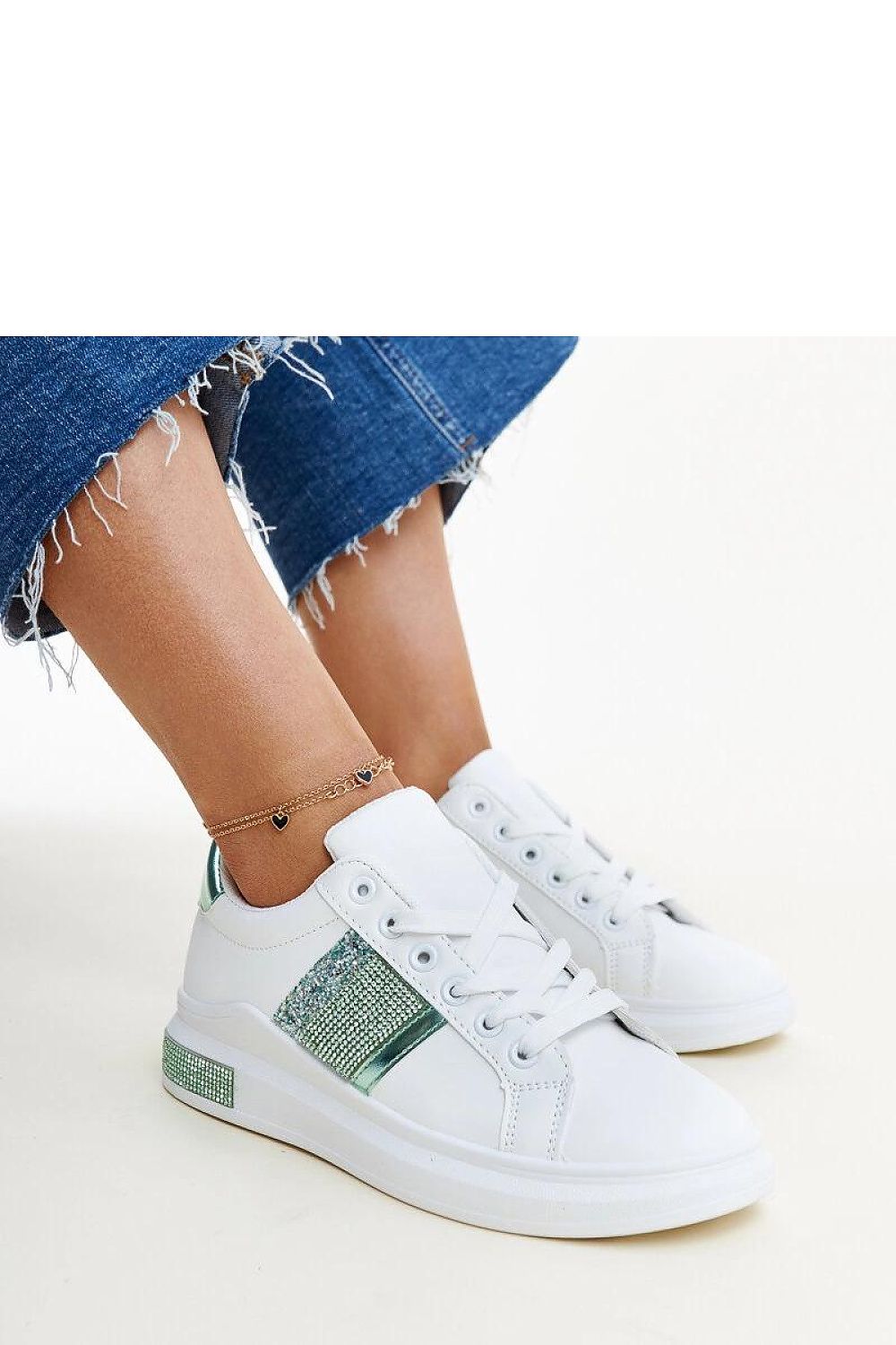 Solea Giulia sneakers showcasing eco leather craftsmanship, featuring a luxurious white and green design, perfect for sporty elegance.