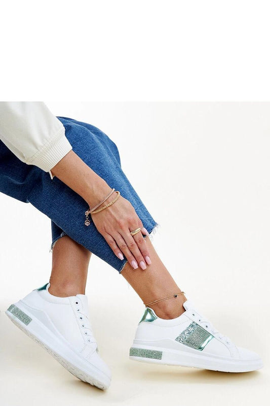 Close-up of Solea Giulia eco leather sneakers in white and green, highlighting the lace-up closure and rounded toe for ultimate comfort and trendy style.