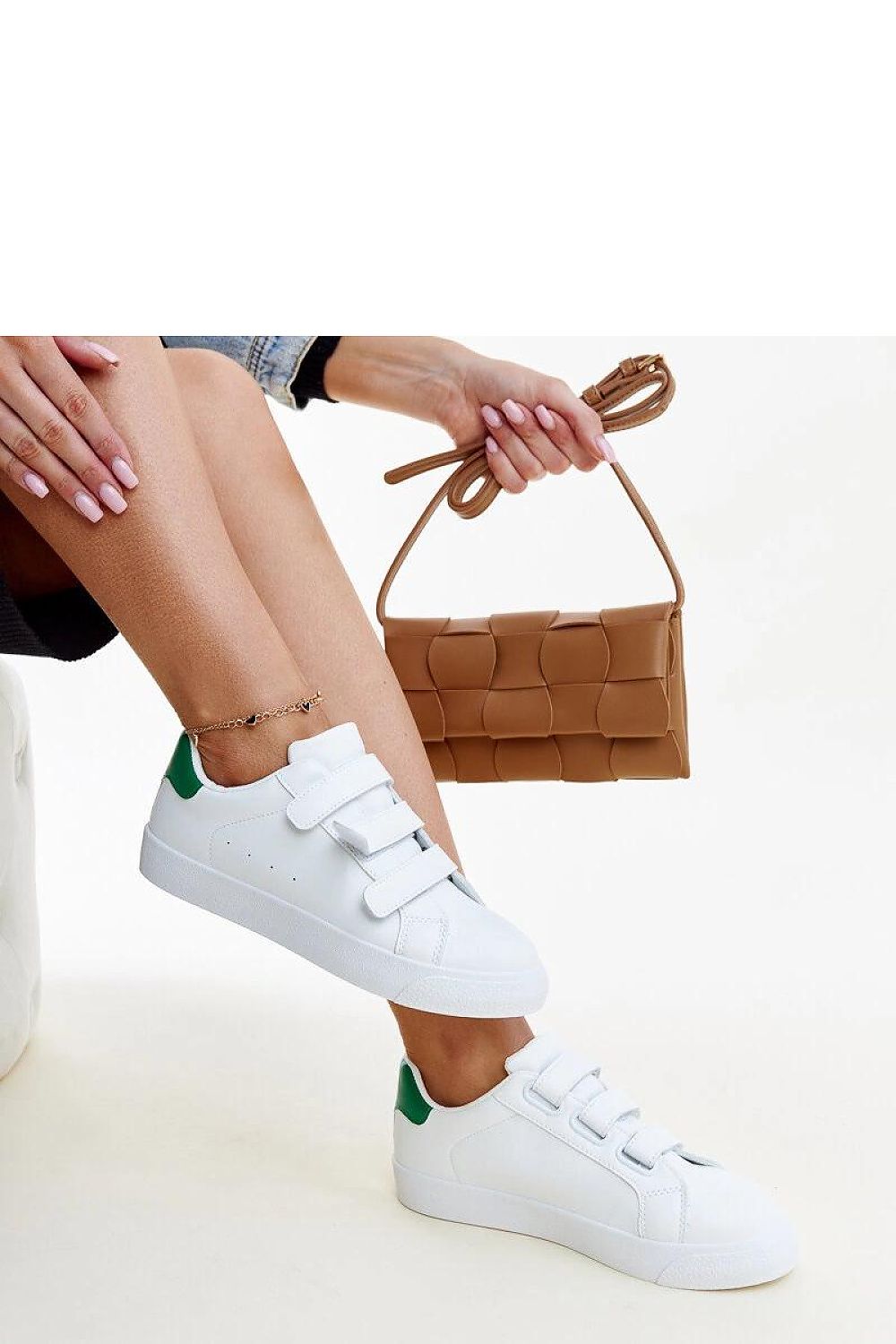 Close-up view of Solea eco leather sneakers in white-green, featuring Velcro closure and high-quality rubber sole for a sophisticated casual look.