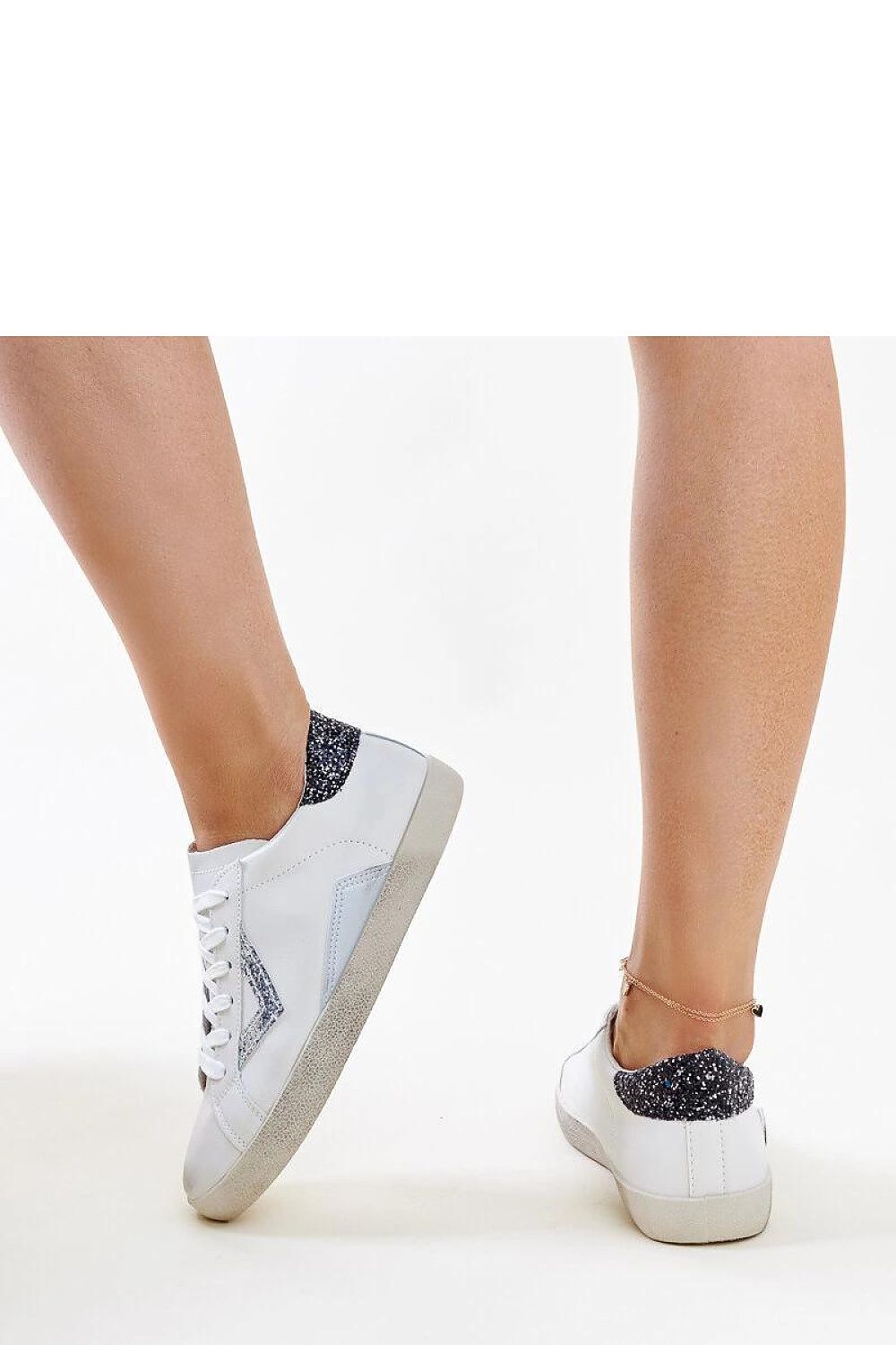 Elegant Solea white sneakers featuring a worn effect, crafted from eco leather for a sustainable yet stylish spring/summer look.