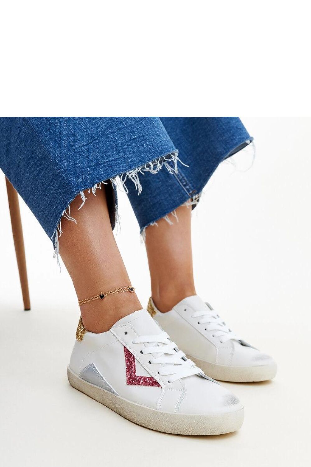 Close-up view of Solea eco leather white sneakers, showcasing their rounded toe design and comfortable laced closure.