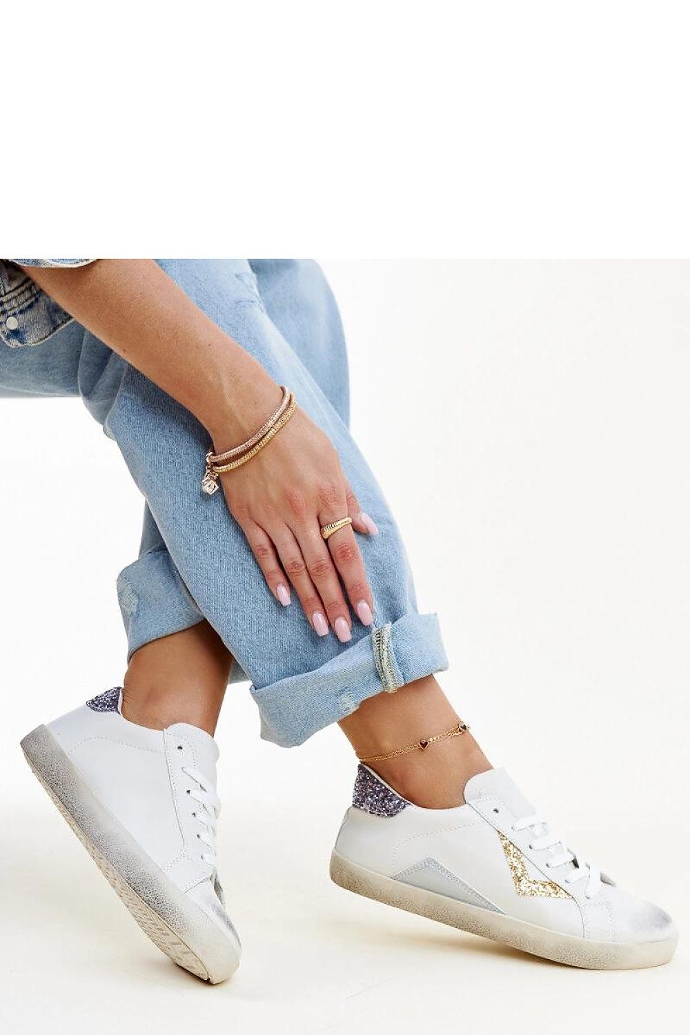 Close-up of Solea white sneakers showcasing the stylish worn effect and eco leather material.