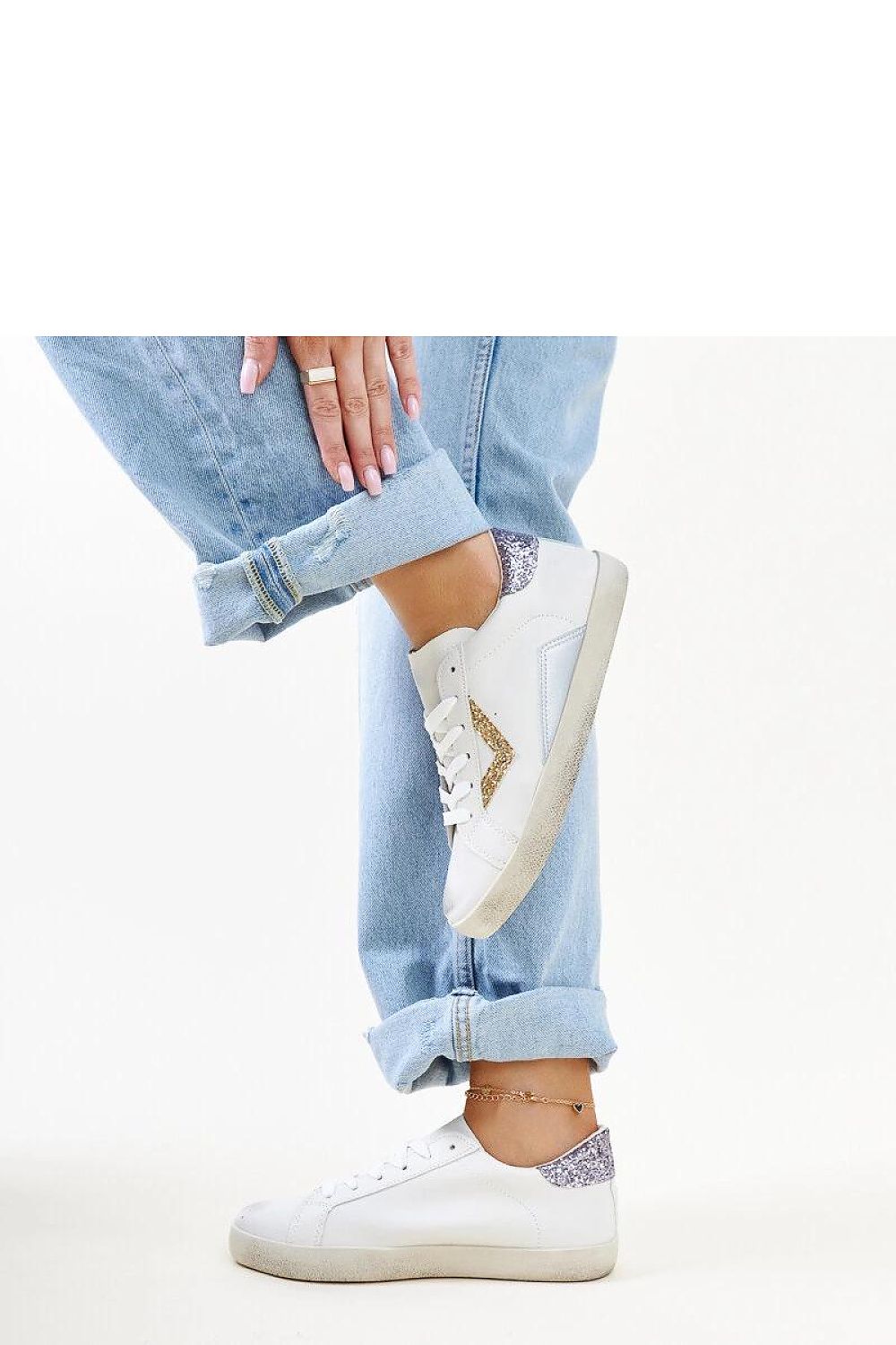 Side view of Solea white sneakers highlighting the laced closure and contemporary design.