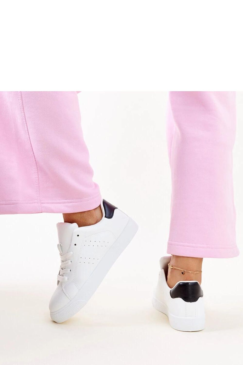 Solea Akila Black and White Sneakers on a stylish backdrop, emphasising their modern aesthetic and eco-friendly materials, suitable for both casual and upscale occasions.