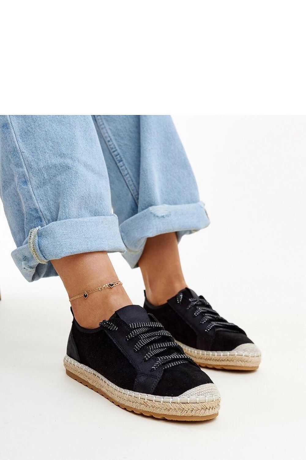 Close-up view of Solea Naila Black Sporty Espadrilles for Women, highlighting the contemporary design and flexible rubber material for optimum comfort.