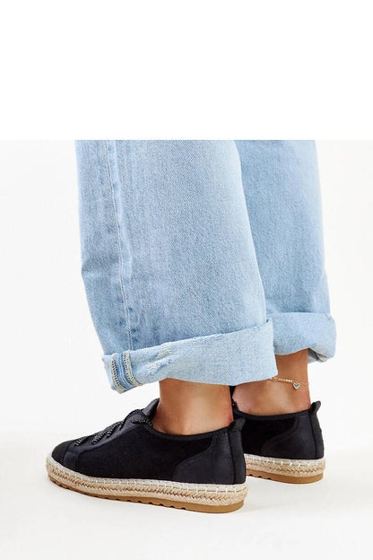 Stylish Solea Naila Black Sporty Espadrilles displayed in a casual summer setting, ideal for a refined yet relaxed look.