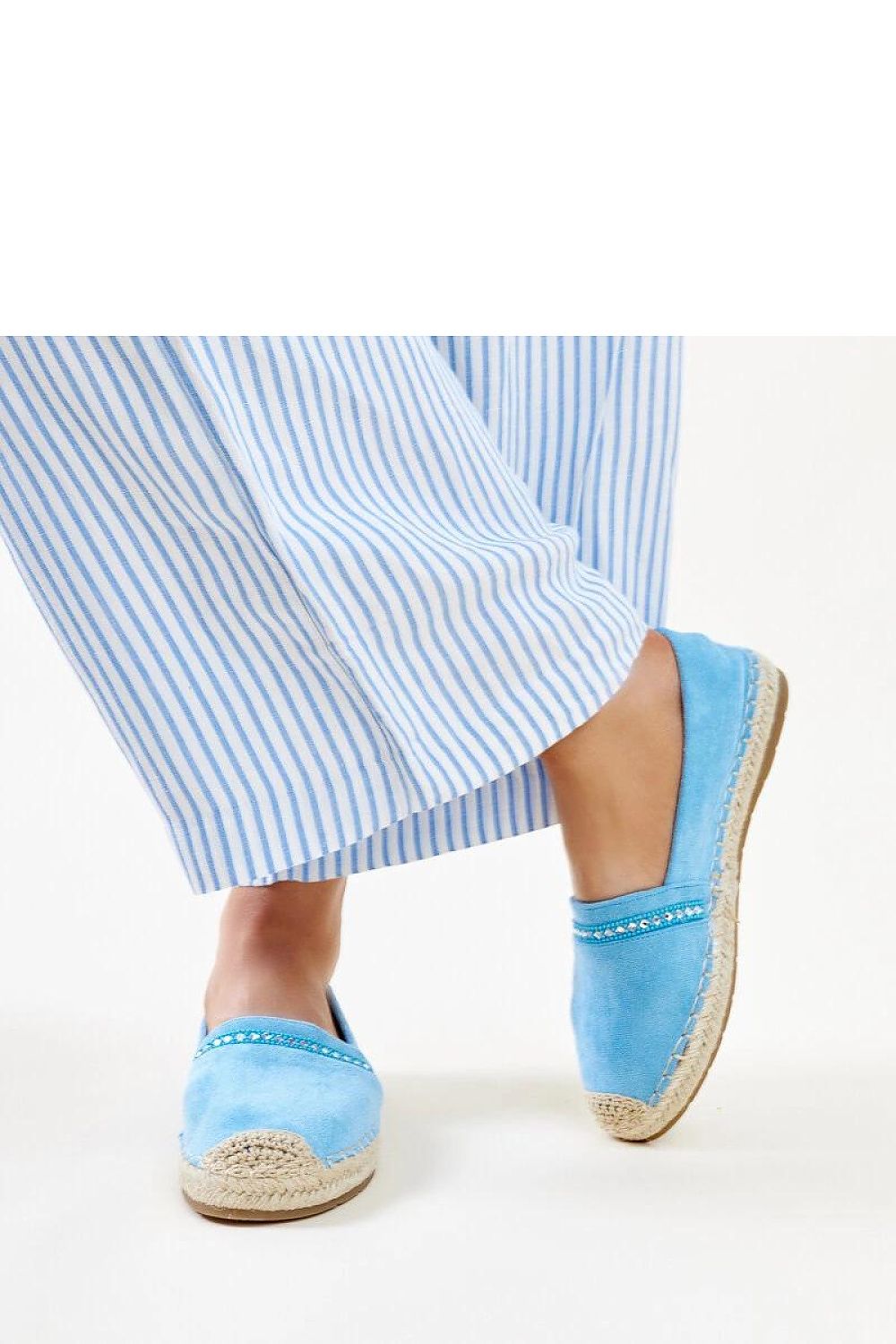 Solea blue espadrilles in a stylish setting, featuring a comfortable slip-on design and adorned with shimmering zirconias, ideal for summer elegance.