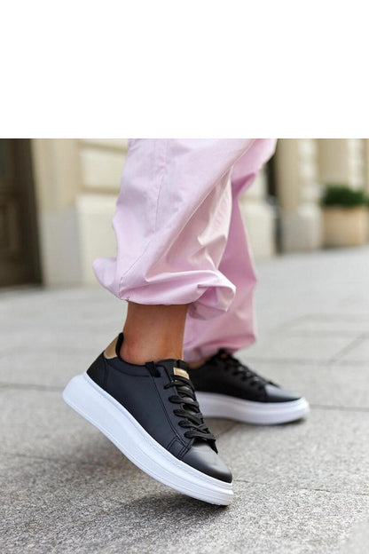 Solea luxurious black lace-up sneakers featuring a thick white rubber sole, designed for a stylish and contemporary look.