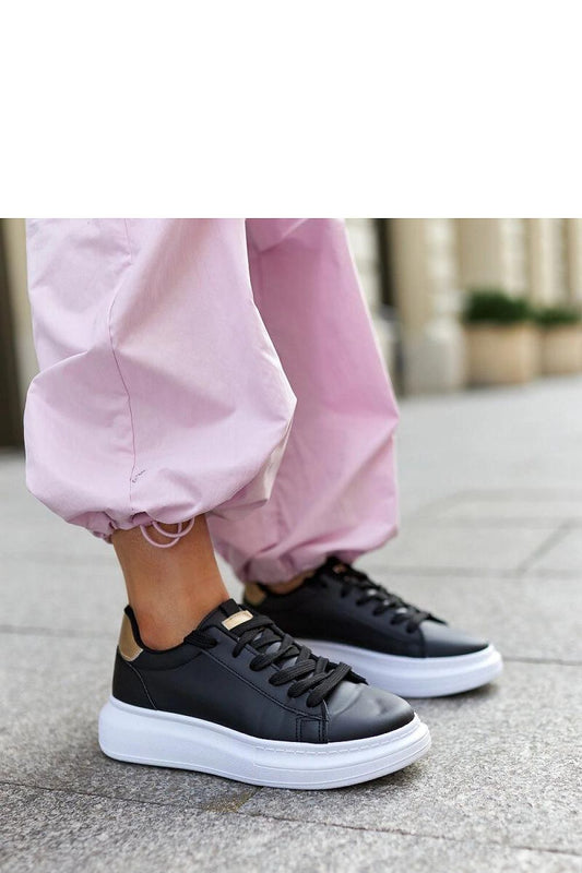 Elegant black eco leather sneakers by Solea with a rounded toe and durable lace-up closure, perfect for modern fashion enthusiasts.