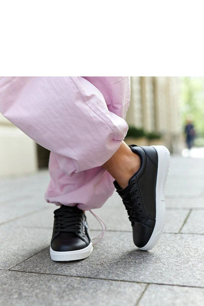 Chic Solea eco-leather sneakers in black, showcasing a low profile and cushioned rubber sole, designed for effortless sophistication.