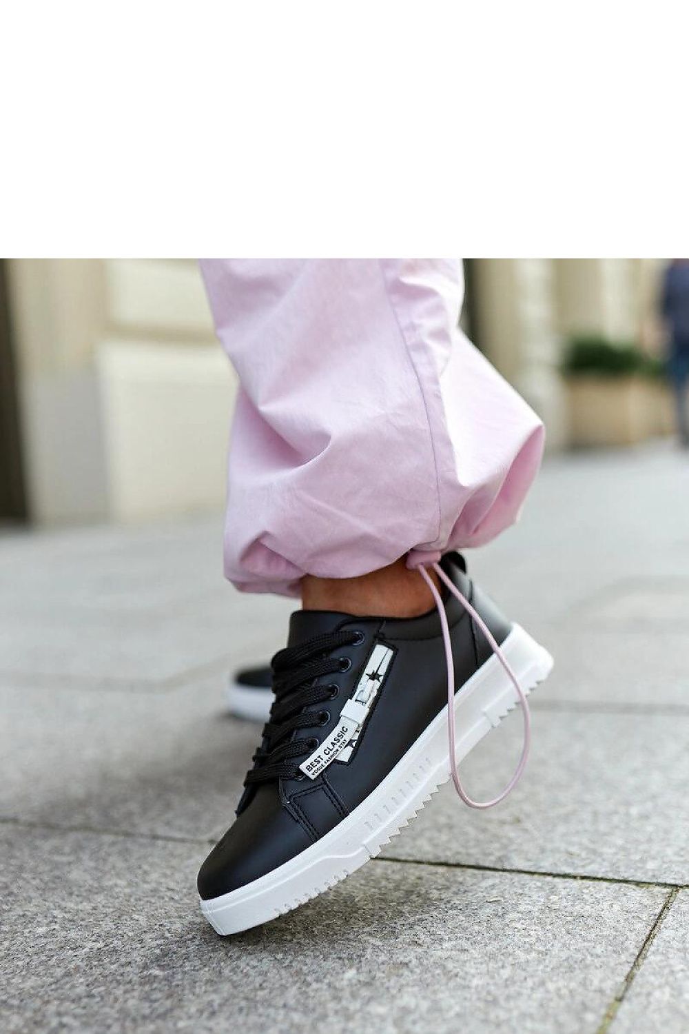 Solea elegant black eco-leather sneakers featuring lace-up closure, designed for comfort and style, ideal for spring and summer fashion.