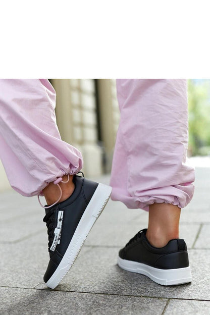 Close-up of Solea eco-leather sneakers, highlighting the chic low cut and round toe, crafted for luxury and durability.