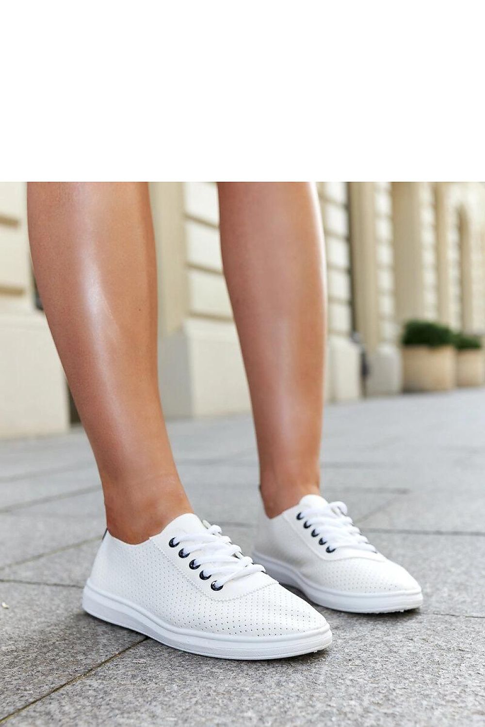 Elegant Solea Women’s White Lace-Up Sneakers Katinka, showcasing premium synthetic leather and high-quality rubber sole, perfect for casual chic attire.