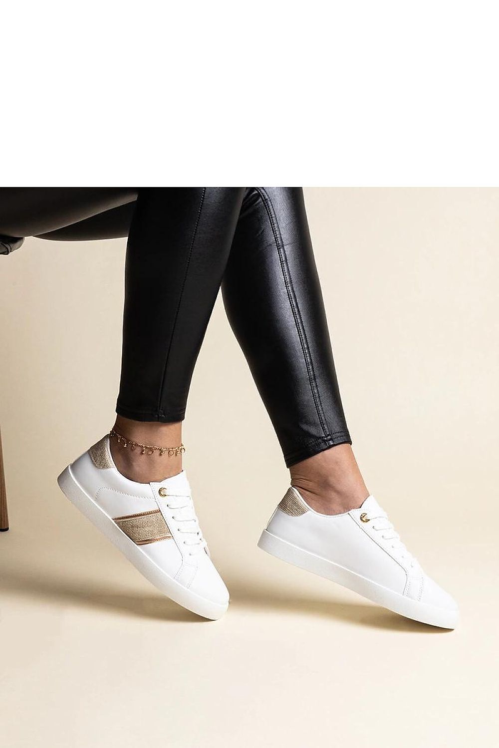 Solea luxury white and gold sneakers for women featuring a decorative strap and elegant zircons, perfect for a modern, stylish look.