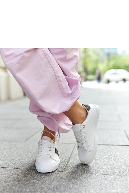 Solea women's sneakers in white and gold, designed for fashionable young women, exemplifying luxury with their elegant styling and high-quality materials.