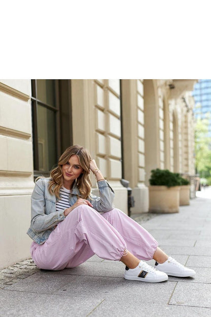 Elegant Solea white and gold sneakers for women featuring a stylish low design, decorative strap, and shimmering zircons.