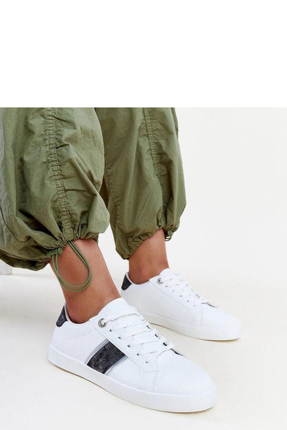 Fashion-forward Solea sneakers featuring a blend of white and gold tones, designed for modern women.