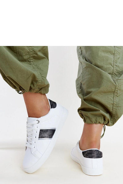 Close-up view of Solea white and gold women's sneakers showcasing the luxurious synthetic suede leather and decorative strap with zircons, ideal for a chic spring/summer collection.