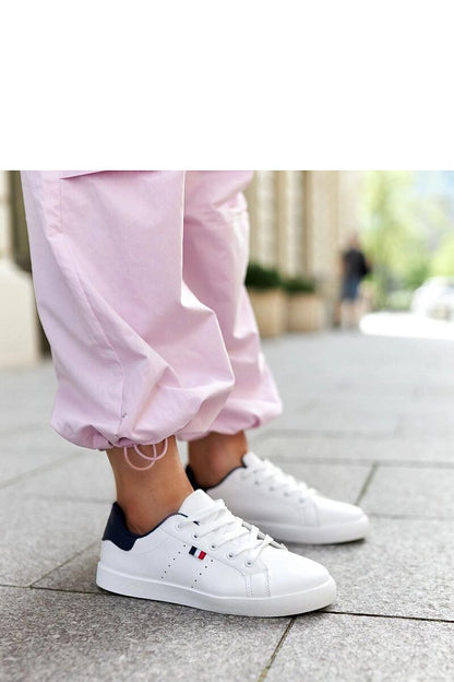 Solea women's stylish white eco-leather sneakers showcasing a low design and rounded toe, perfect for luxury street fashion.