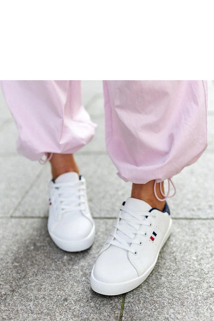 Elegant Solea eco-leather sneakers for women highlighting their comfortable fit and rubber sole in a pristine white color.