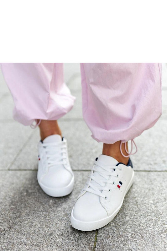 Elegant Solea eco-leather sneakers for women highlighting their comfortable fit and rubber sole in a pristine white color.