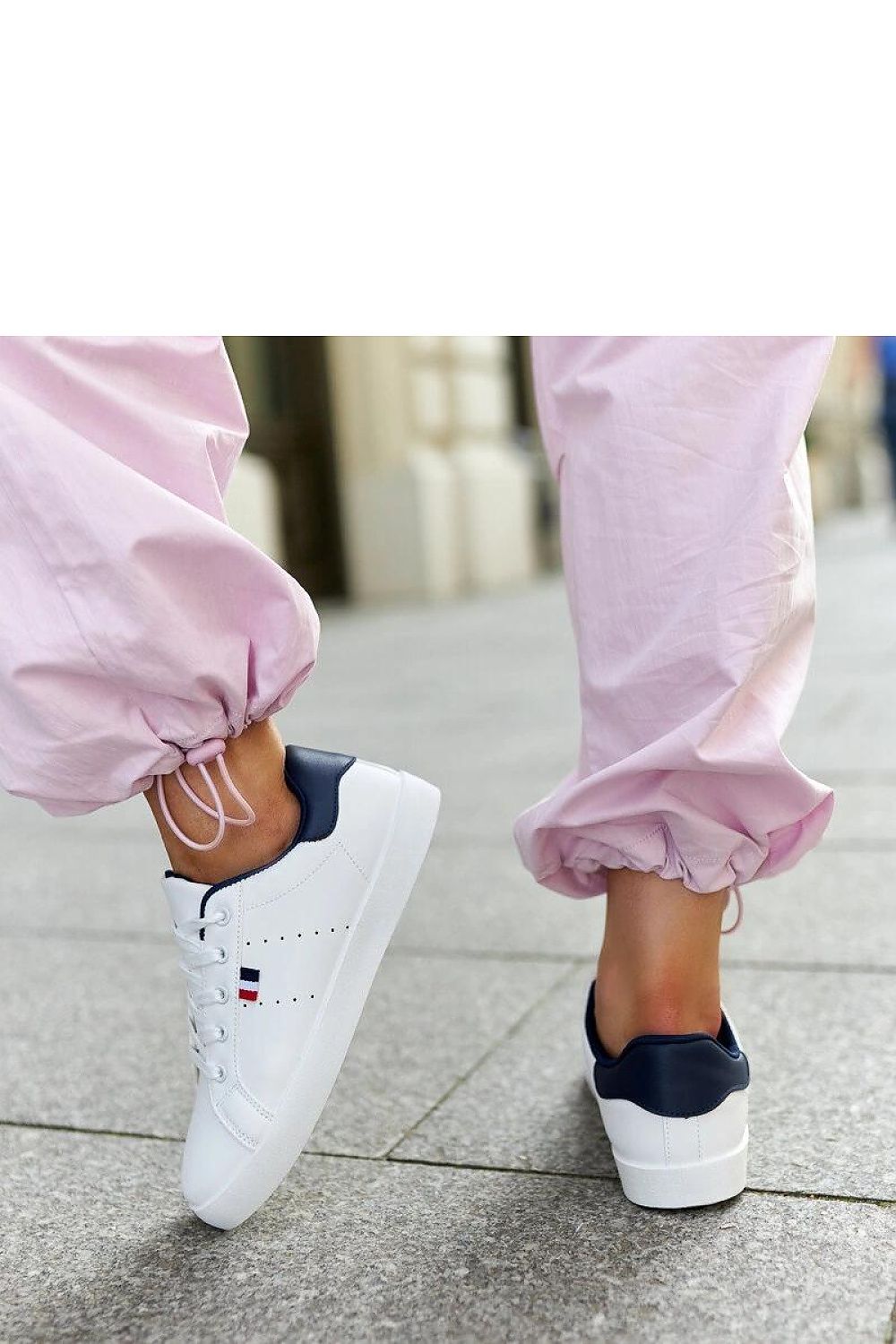 Chic Solea white eco-leather sneakers for women, featuring laces for a custom fit, ideal for both comfort and fashion.