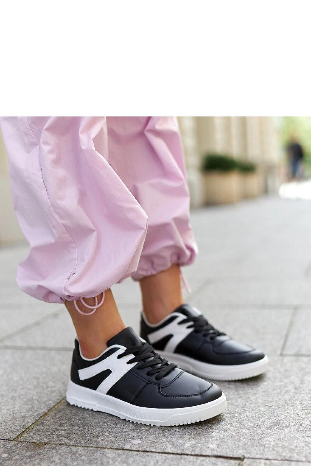 Stylish Solea Black Hagara sports sneakers for men and women, featuring a lace-up design, crafted from eco leather, perfect for adding a sporty luxury touch to casual outfits.