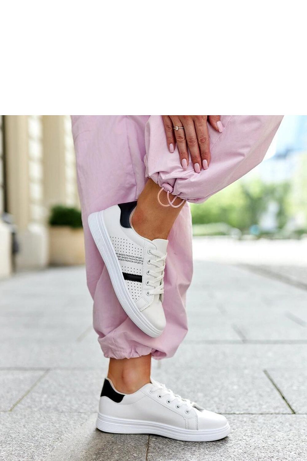 Solea Berdine sneakers in white with a low upper and rounded toe, representing a luxurious blend of comfort and fashion.