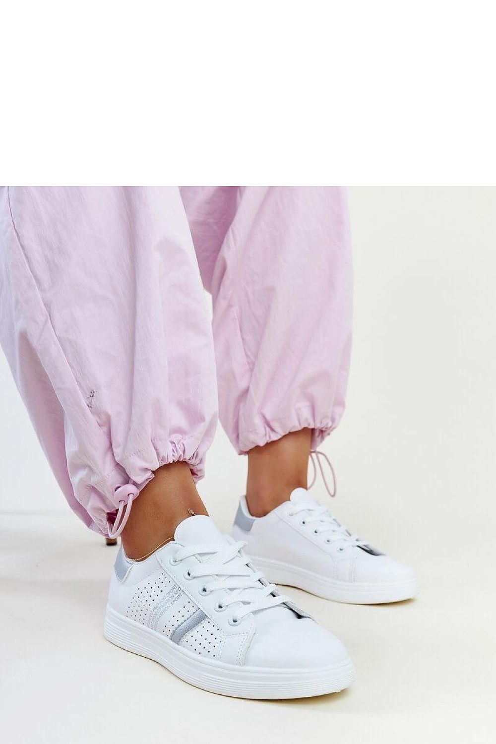 Close-up of Solea White Berdine Sneakers highlighting the eco-leather texture and stylish low upper design.