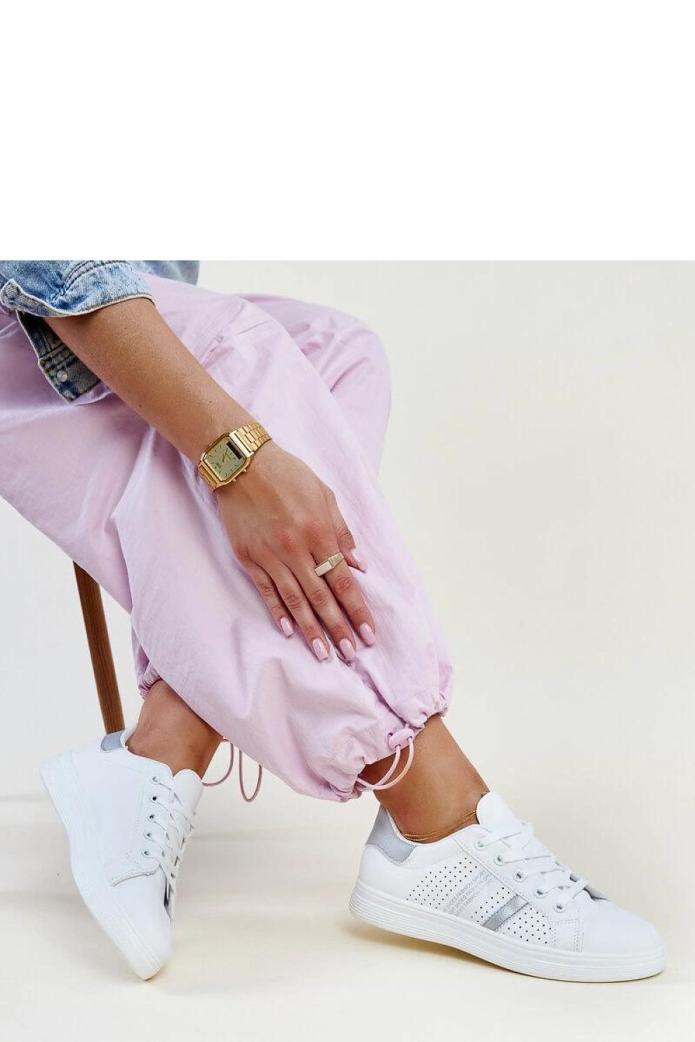 Side view of Solea Eco-Leather White Berdine Sneakers, elegantly styled for women, featuring a white rubber sole for all-day comfort.