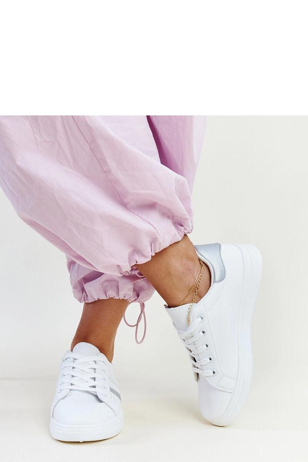Solea Women's White Berdine Sneakers displayed with laces tied, emphasising their chic and environmentally-friendly design.