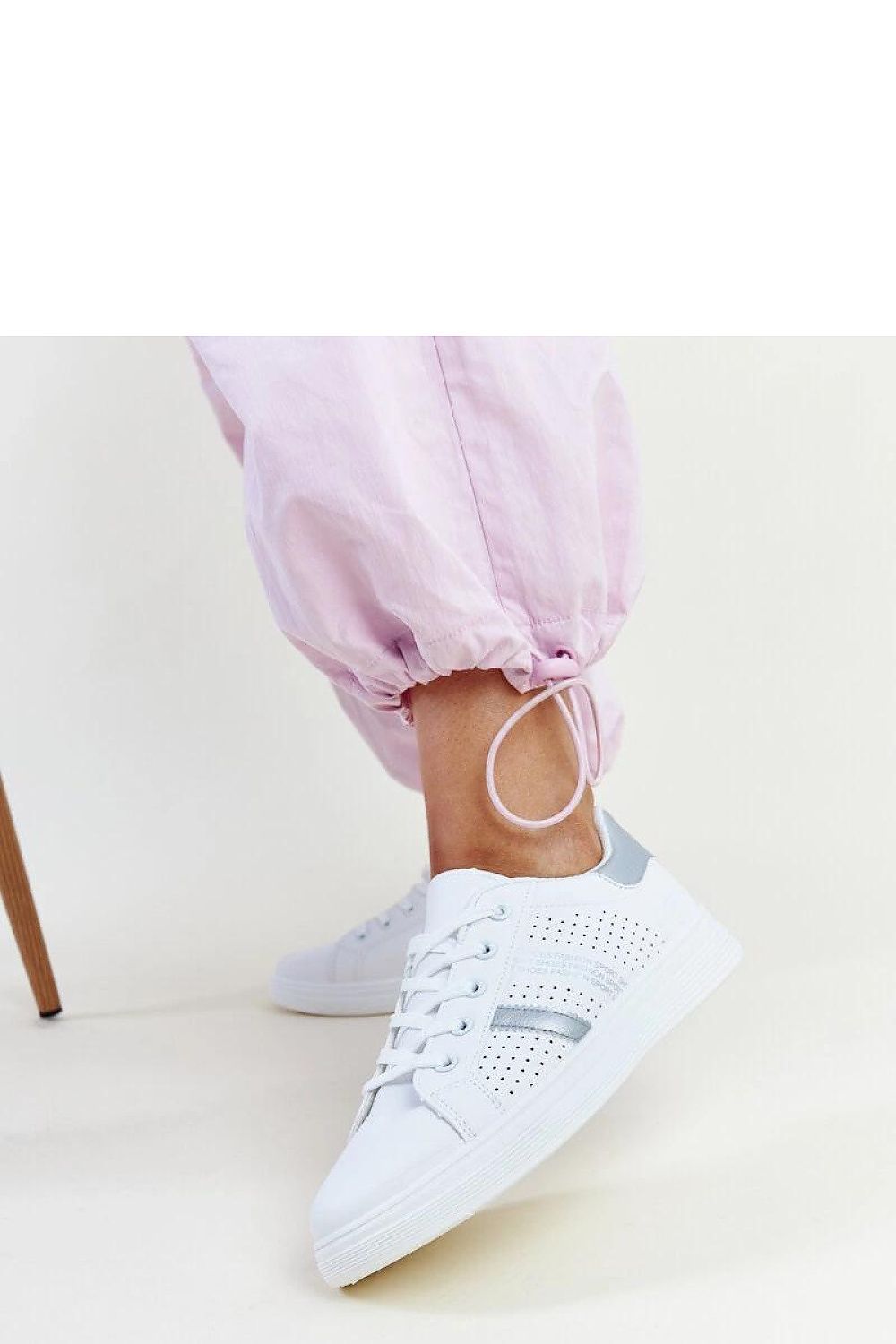 Elegant Solea Eco-Leather White Berdine Sneakers for Women resting on a clean surface, showcasing their luxurious appeal and comfortable fit.