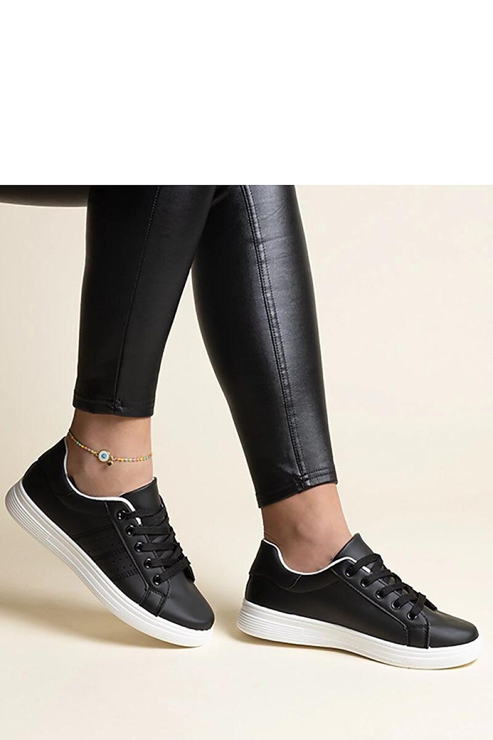 Luxurious Solea white eco leather sneakers featuring elegant black detailing, perfect for adding sophistication to your footwear collection.