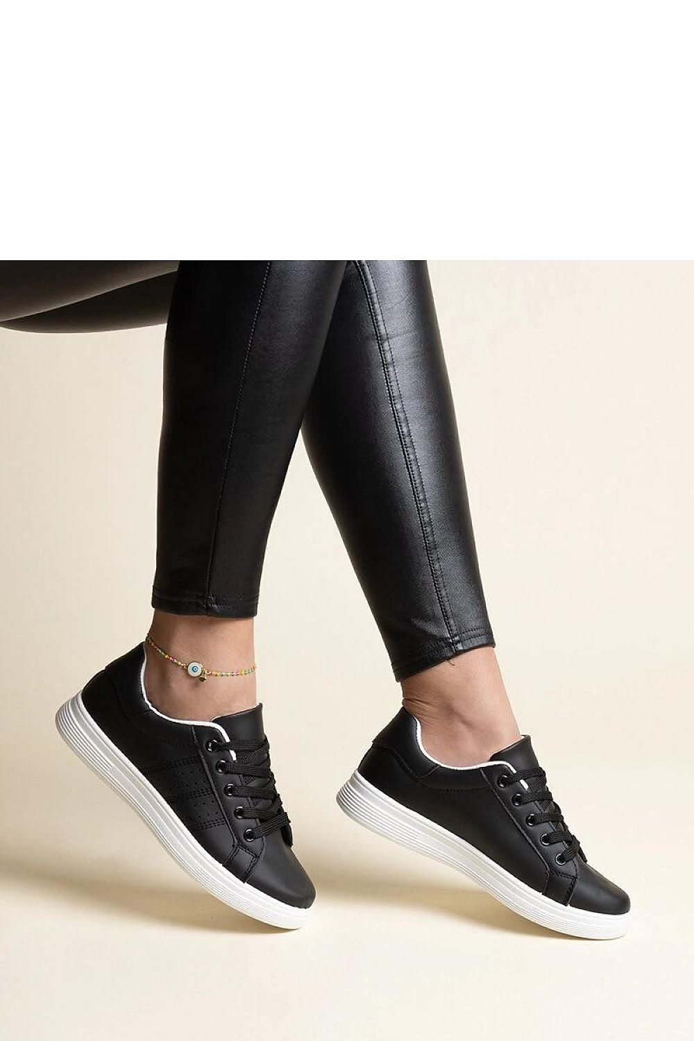 Solea eco leather sneakers in white with a chic black accent, designed for comfort and style for discerning fashion enthusiasts.