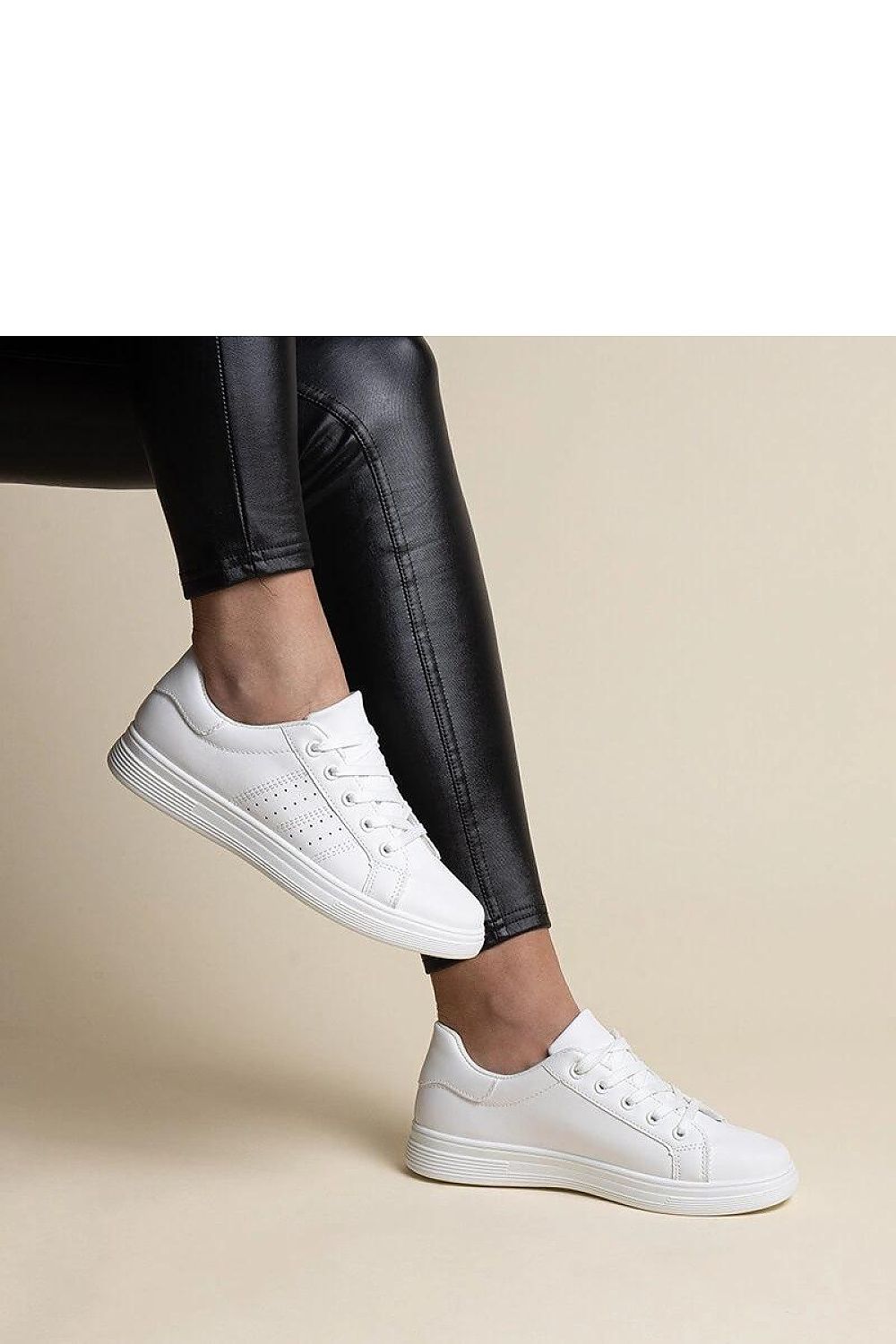 Stylish Solea white sneakers with rounded toes and black elements, crafted from eco-friendly materials for a trendy yet sustainable choice.